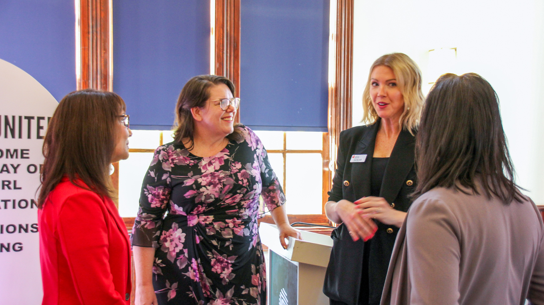 Four women conversing