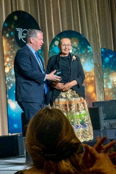 Elder Jackie Bromley, UWCA Indigenous Advisory Committee, receiving her award.