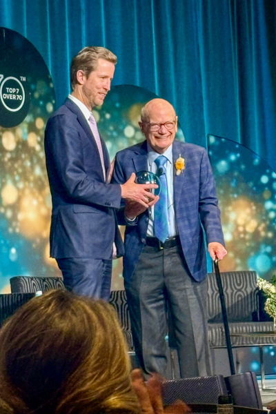 Ron Freckleton, Inspirational Impact Speaker, receiving his award.