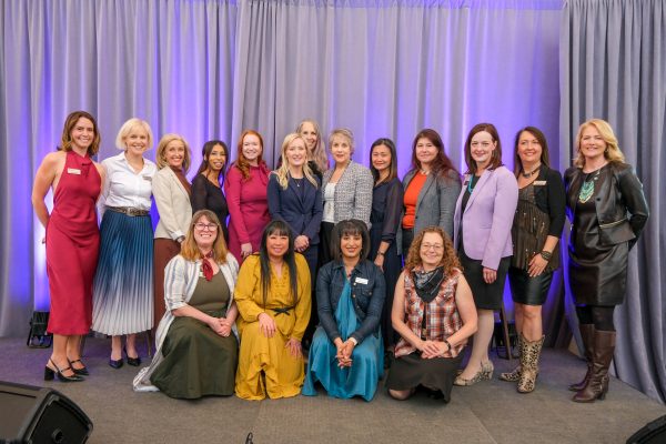 A group of women pose for a photo